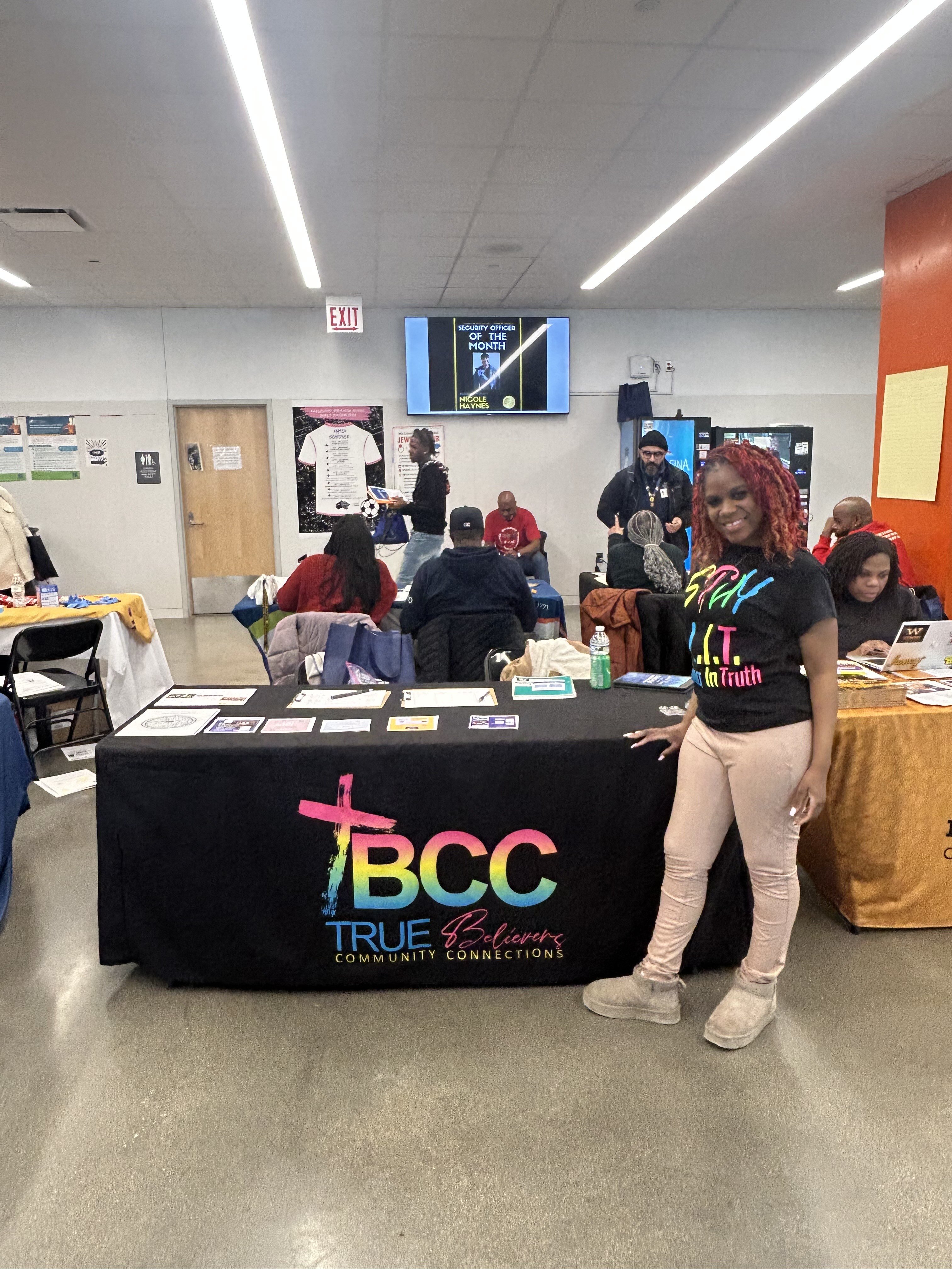 A TBCC volunteer in our Stay L.I.T. shirt