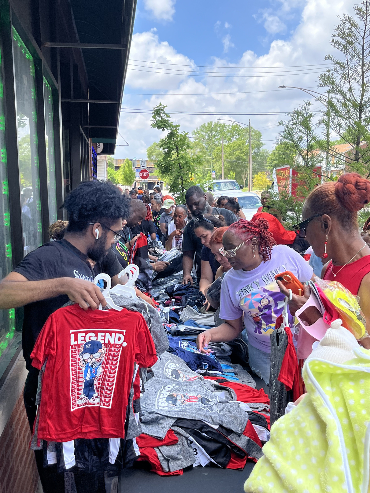 Neighbors gathering at a TBCC community giveaway